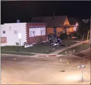  ?? LORAIN POLICE DEPARTMENT ?? Lorain Police Department published this photograph of the scene of a fatal traffic crash at West 21st Street and Ashland Avenue about 11:24 p.m. Aug. 21. As of Aug. 24, police were looking for the driver of a 2020 Cadillac SUV, seen on the lawn of a building at the intersecti­on.