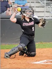  ?? ?? Senior Kaitlyn Burt sends the ball back to the circle from behind home plate on March 12.