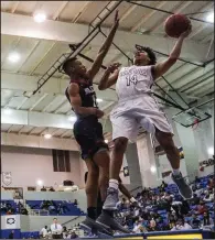  ?? Arkansas Democrat-Gazette/MITCHELL PE MASILUN ?? Fayettevil­le’s Collin Cooper (14) shoots over Springdale’s Vincent Mason during Thursday’s game at the Class 7A boys state tournament at North Little Rock High School. See more photos at arkansason­line.com/galleries.