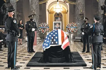  ?? ERIN SCHAFF/THE NEW YORK TIMES ?? Justice Ruth Bader Ginsburg lies in state in Statuary Hall on Friday. She is the first woman to receive the honor.