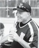  ?? COURTESY PHOTO ?? Eric Selckmann as an assistant coach for Northeast baseball. Selckmann died Sept. 26 at the age of 50.