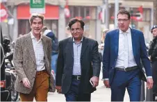  ?? AFP ?? Asia Bibi’s lawyer Saif-ul-Mulook (centre) arrives to give a press conference in The Hague yesterday after fleeing Pakistan earlier in the week due to threats.