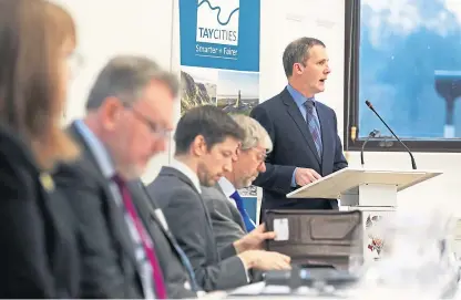  ??  ?? Michael Matheson MSP, Cabinet Secretary for Transport, Infrastruc­ture and Connectivi­ty, and partners at Perth Civic Hall in 2018 to sign up to the terms of the Tay Cities Deal agreement.