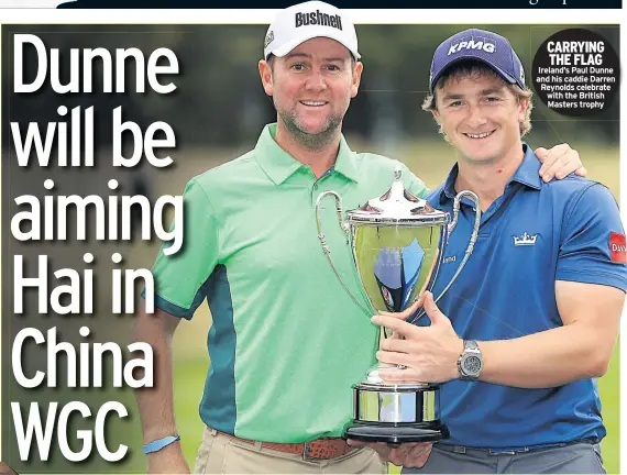  ??  ?? CARRYING THE FLAG Ireland’s Paul Dunne and his caddie Darren Reynolds celebrate with the British Masters trophy