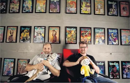  ?? Francine Orr Los Angeles Times ?? “RICK AND MORTY” spins from the minds of Dan Harmon, left, holding a Rick doll, and Justin Roiland, with Morty. The show is on Cartoon Network’s Adult Swim.