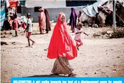  ??  ?? BELEDWEYNE: A girl walks towards her tent at a displaceme­nt camp for people affected by intense flooding in Beledweyne, Somalia. —AFP