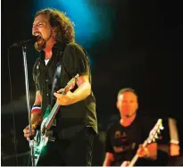  ??  ?? In this Sept. 2, 2012, file photo, Pearl Jam performs at the "Made In America" music festival in Philadelph­ia. — AP photos