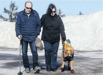  ??  ?? Mike and Julie make their way into Civic hospital for the final ALS test. Mike is understand­ably nervous about this last procedure. He already has trouble walking and it won’t be long before he’s in a wheelchair.