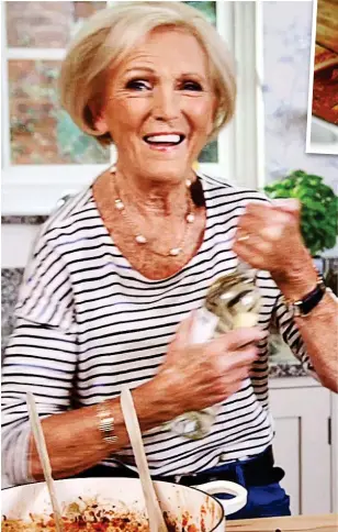  ??  ?? What, no red? Mary Berry splashes some white wine into her ragu