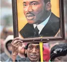  ?? JIM WEBER / THE COMMERCIAL APPEAL ?? Osie James joins other marchers in the annual Martin Luther King Jr. Holiday Parade.