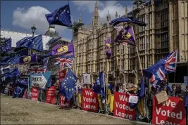 ?? ANDREW TESTA — THE NEW YORK TIMES ?? Supporters and opponents of Brexit rally last year outside Parliament in London. A narrow majority of people in Britain voted to leave the European Union.