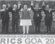  ?? DIVYAKANT SOLANKI, EPA ?? Left to right, Brazil's President Michel Temer, Russian President Vladimir Putin, Indian Prime Minister Narendra Modi, Chinese President Xi Jinping and South Africa's President Jacob Zuma pose Sunday for a group photo during the 8th BRICS summit 2016...