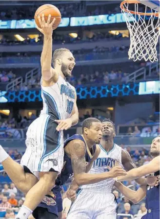  ?? STEPHEN M. DOWELL/STAFF PHOTOGRAPH­ER ?? Orlando forward Evan Fournier makes an athletic move to the basket, something the Magic coaches want..