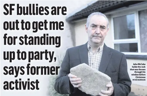  ?? PETER MORRISON ?? John McCabe holds the rock that was thrown
through his window before
Christmas