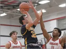  ?? DAVID DALTON — FOR MEDIANEWS GROUP ?? Tyler Jamison shoots for two of the 28points he scored to help Port Huron Northern defeat Lake Shore 49-47on Monday.