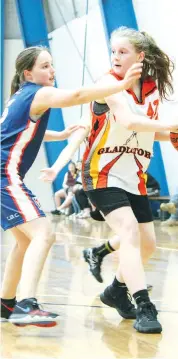  ??  ?? Galdiators player Jessica Haley protects the ball from Chalkies player Emma Rollinson.