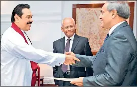  ??  ?? FLASHBACK TO 15th JANUARY 2013: Mohan Peiris going through the motions of purportedl­y taking oaths as Chief Justice before President Rajapaksa in what is now determined to have been a totally farcical swearing in ceremony devoid of any legal force or...
