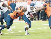  ?? MICHAEL J. OKONIEWSKI­S | SPECIAL TO THE COURANT ?? UCONN quarterbac­k David Pindell is sacked in the second half Saturday. Overall, the Huskies gave up six sacks, and Pindell often was forced to throw the ball away under pressure.