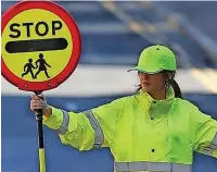  ?? SS Digital Images ?? ●●Michelle Keegan as a lollipop lady while filming Brassic in Bacup