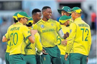  ?? /Ashley Vlotman/Gallo Images ?? Making a
stand: Lungi Ngidi, centre, celebrates a wicket in a T20 Internatio­nal against Australia in February with teammates, who he says should make a stand in the Black Lives Matter movement.