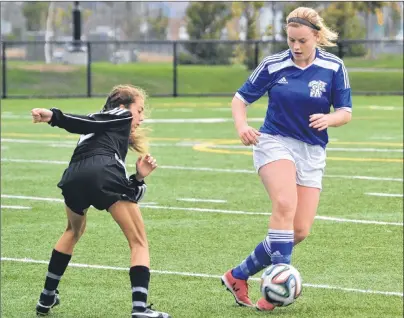  ?? CHRISTIAN ROACH/ CAPE BRETON POST ?? Alesha Hoban of Sydney Academy controls the ball as Cloe MacPherson of BEC plays defence during Division 1 girls action in the Cape Breton Soccer League on Tuesday at Open Hearth Park. BEC won 5-0.