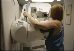  ?? KIMBERLY P. MITCHELL — DETROIT FREE PRESS ?? A woman gets a mammogram at the University of Michigan Cancer Center in Ann Arbor, Mich.