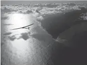  ?? JEAN REVILLARD/SOLAR IMPULSE VIAAP ?? The solar powered plane, Solar Impulse 2, piloted by Bertrant Piccard of Switzerlan­d, is coasts through the air Thursday after successful­ly taking off from Kalaeloa Airport, O’ahu, Hawaii, for a nonstop three-day flight.