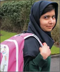  ??  ?? Triumph: Malala sets off for school yesterday