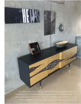  ?? ?? The faux concrete walls are the perfect backdrop for some of Jeanine’s colourful Bye Bye Love upcycled furniture pieces. This piece features Resene Gunmetal on its sides and colours such as Resene Grey Friars and Resene Tuna in the riverbed design.