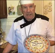  ?? TOBIAS/WICHITA EAGLE/TNS SUZANNE PEREZ ?? Armando Perez explains the special “para volver la tortilla” plate he uses to make Cuban breakfast tortillas: “That means ‘to turn the tortilla over.’”