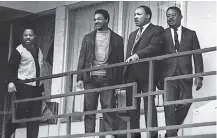  ?? ASSOCIATED PRESS FILE PHOTO ?? In this April 3, 1968, photo, the Rev. Martin Luther King Jr. stands with other civil rights leaders on the balcony of the Lorraine Motel in Memphis a day before he was assassinat­ed at approximat­ely the same place. From left are Hosea Williams, Jesse...
