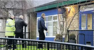  ??  ?? ●●Police at Tonacliffe Primary School after the hoax bomb alert