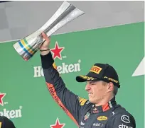  ??  ?? Max Verstappen celebrates his victory in Brazil.