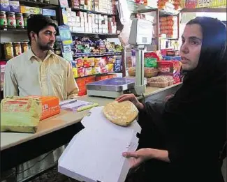  ??  ?? Tough job Lahore restaurant owners referr to Aysha Mumtaz as the toughest lady in town.
Washington Post