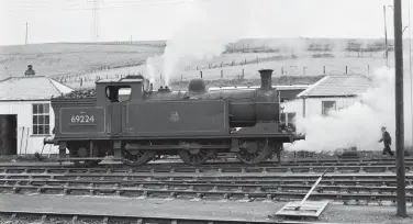  ?? Kiddermins­ter Railway Museum J Wood F G Wood/Kiddermins­ter Railway Museum ?? At work on the south side of Keith Junction station on Saturday, 23 August 1958 is the nearby shed’s ex-LNER ‘N15/1’ class 0-6-2T No 69224, with the boiler on the mark and the drain cocks doing little for the shunter’s visibility. The last built member of its class, in April 1924 and appropriat­ely from the NBR’s own Cowlairs Works as a final batch of 20 of the W P Reid NBR design, at Keith it had followed in the footsteps of classmate
No 69201, albeit that 0-6-2T was on the books for less than a month, and two months with no ‘N15’ then followed. No 69224 had two periods of allocation at Keith, with this view recorded five months into the first. Ultimately, No 69224 would conclude its career working as a St Margaret’s engine, its demise coming in the week ending 1 October 1962.
Sporting a 61C shedplate to denote allocation to Keith shed, stovepipe chimney-fitted McIntosh ‘439’ class 0-4-4T No 55221 is on passenger stock in the east-facing bay at Elgin station on 26 June 1956. It seems likely that this ‘2P’-rated engine is acting as the station pilot, although once allocated to Keith both Nos 55185 and 55221 were known to work Elgin-Lossiemout­h branch duties. By the date of this view nearly a decade had passed since Elgin shed lost the last of its own allocation and became a sub-shed of Keith. The pictured tank engine was completed at the Caledonian Railway’s own works at St Rollox, Glasgow in August 1914 as CR No 222, and while its early BR career still found it on ex-CR territory, the move from Beattock to Keith at the end of August 1953 pushed new frontiers, Aberdeen being the nearest former CR location.