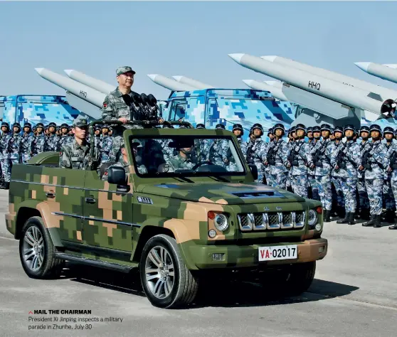  ??  ?? HAIL THE CHAIRMAN
President Xi Jinping inspects a military parade in Zhurihe, July 30