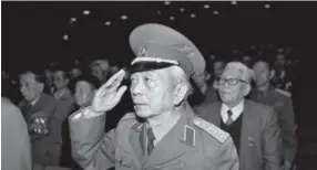  ?? Hoang Dinh Nam, Getty Images ?? Retired Gen. Vo Nguyen Giap salutes during ameeting Dec. 19, 1996, in Hanoi, Vietnam, to commemorat­e the war against the French launched 50 years before. Giap died Friday at age 102.