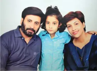  ?? FAMILY PHOTO ?? Parents Rajesh, left, and Nupur Talwar flank their daughter Aarushi.