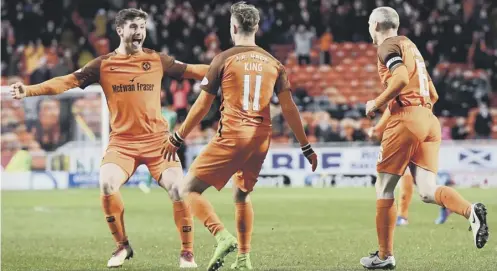  ??  ?? 0 Dundee United matchwinne­r Billy King celebrates his early goal against St Mirren with team-mate Anthony Ralston.