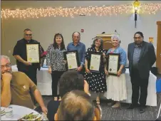  ?? VIRGINIA CLARK/For the Taos News ?? From left: Fr. Mike Garcia, and Ranchos Enjarre Committee Tammy Jaramillo, Tommy Tafoya, Guadalupe Tafoya, and County Manager Brent Jaramillo.