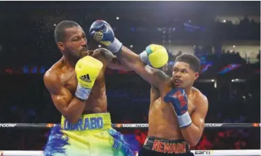  ?? R euters ?? ±
Shakur Stevenson punches Robson Conceicao during their WBC/WBO Jr. Lightweigh­t World title bout.