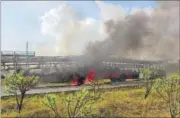  ??  ?? The protesters set buses ablaze and blocked the Agra-Mumbai highway on Sunday. MAYUR BARGAJE/ HT