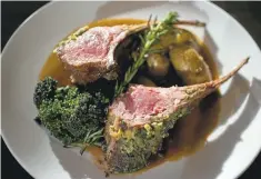  ??  ?? Faz restaurant’s rack of lamb is grilled to perfection and comes with roasted potatoes and seasonal vegetables.