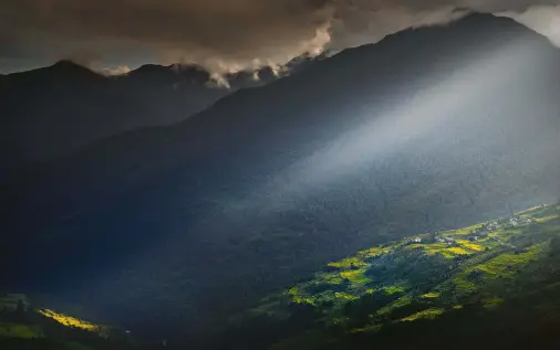  ??  ?? BELOW TSHANGKHA, BHUTAN An evening storm blew in and we were treated to a dramatic light show.The sunbeam itself is central to the compositio­n, and is enhanced by a subdued and supportive landscape below