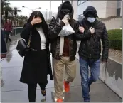  ?? THE ASSOCIATED PRESS ?? Former FBI informant Alexander Smirnov, center, leaves the courthouse on Tuesday in Las Vegas.