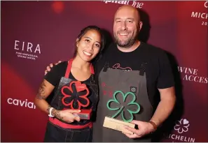  ?? MARC PATRICK — COURTESY PHOTO ?? Blackbelly Market’s head butcher, Kelly Kawachi, shows off her Michelin award, along with Blackbelly owner Hosea Rosenberg with the restaurant’s Green sustainabi­lity Star.