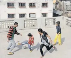  ?? SAMIR JANA / HT ?? KOLKATA (below): Even this sleepy metro has lost open spaces to developmen­t. “Growing up, we had maidans and gardens. Today, my sixyearold has nowhere to play,” says finance manager Ramit Pal, 43. Here, a group plays football on a terrace.