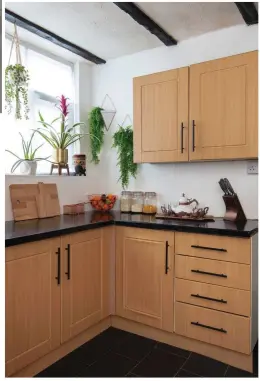  ??  ?? The kitchen is on their renovation to-do list. ‘I’m going to play with the layout and swap some wall cabinets for open shelving. I spend a lot of time in the kitchen, so I want a breakfast bar,’ says Alimah. ‘I’ll keep the beams but paint them’