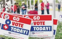  ?? Elizabeth Conley/Staff photograph­er ?? Voting signs line Emancipati­on Park during a rally hosted by the League of Women Voters Houston.