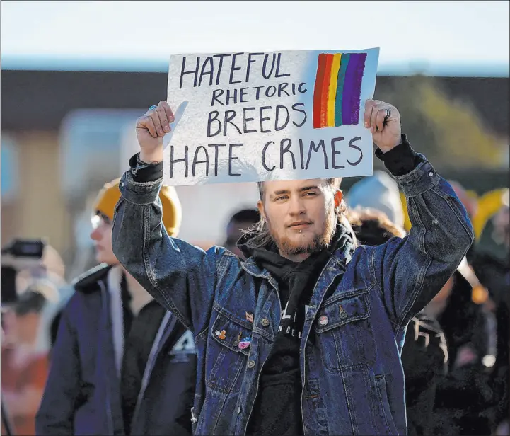  ?? Isaiah J. Downing
Reuters ?? A demonstrat­or holds up a sign during a march in solidarity supporting those affected after a mass shooting at LGBTQ nightclub Club Q in Colorado Springs, Colo.